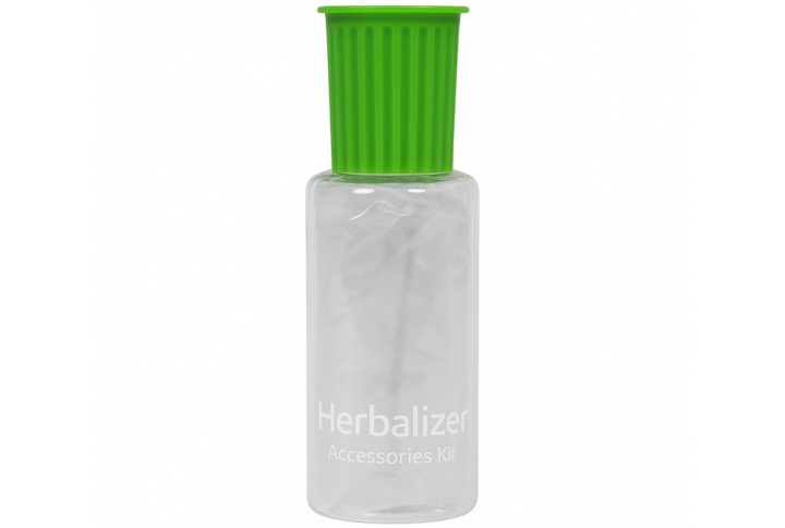Herbalizer accessory kit box contents laid out including balloons whip and mouthpiece