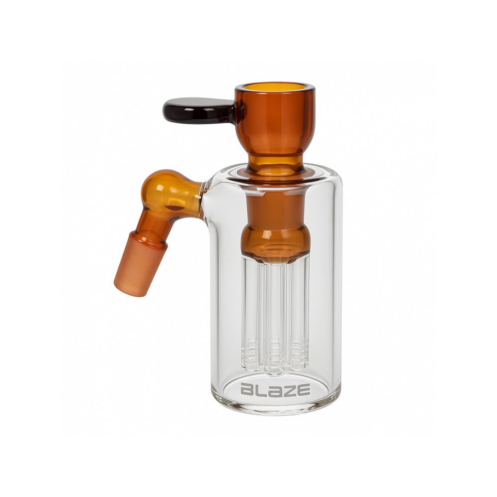 Amber cylinder pre-cooler with included 18.8mm bowl and adapter laid flat on surface